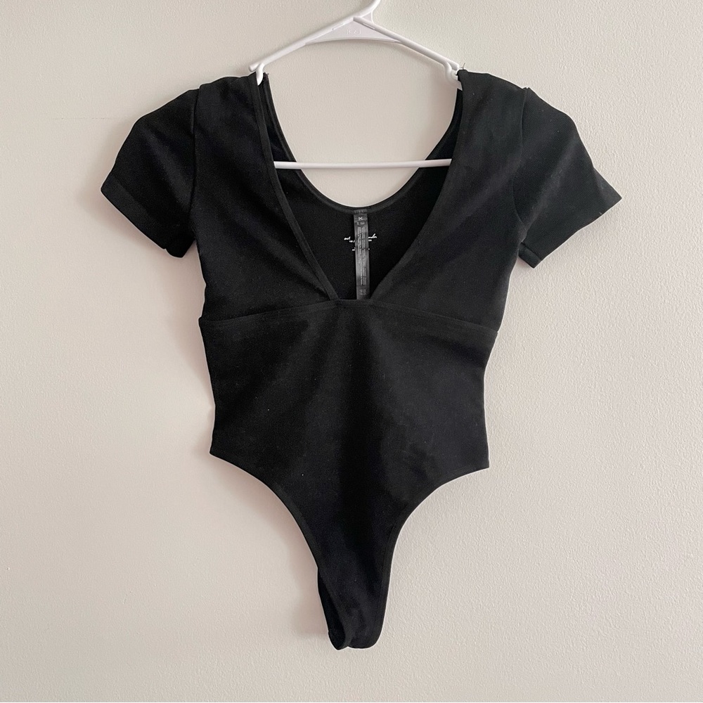 Out from under deep v bodysuit